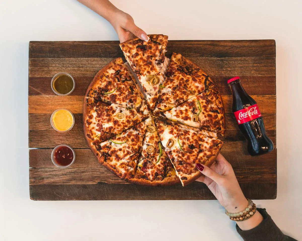 Pizza coming fresh from the oven