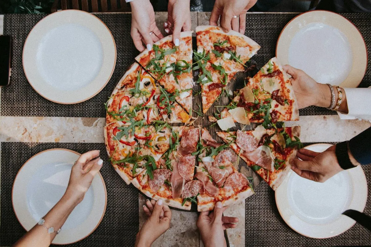 Freshly prepared pizza menu news photo